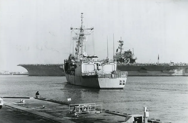 November 1987: The Stark leaving Mayport for Pascagoula, MS with the USS Forrestal CV-59 in the background.
